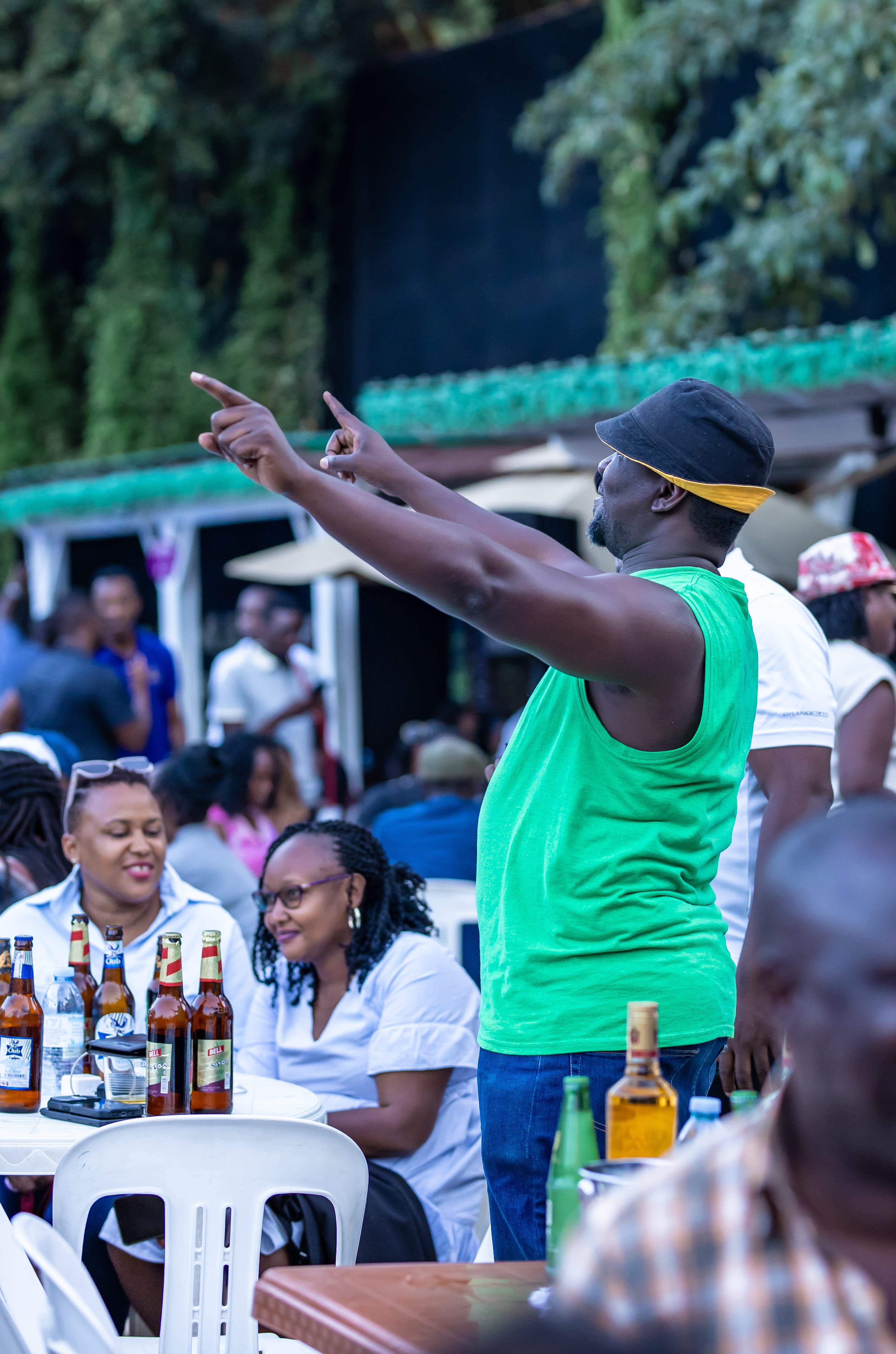 A guest enjoying the music with the crowd behind her